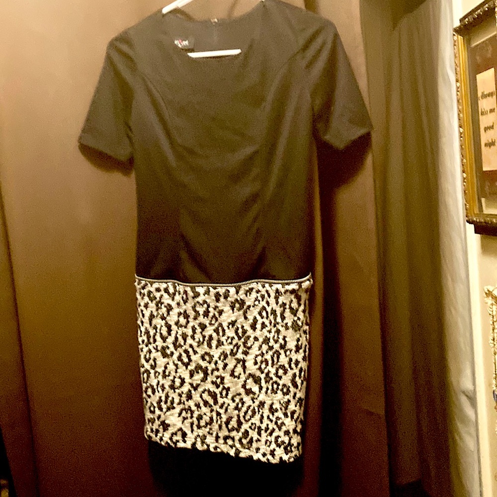 A dress that looks like a two piece outfit. Black top half  mini skirt like bum